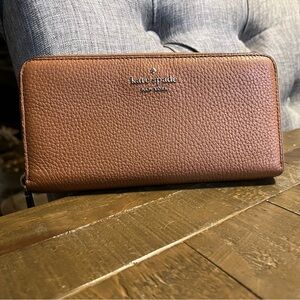 Mild/moderate wear Kate Spade zip around wallet.